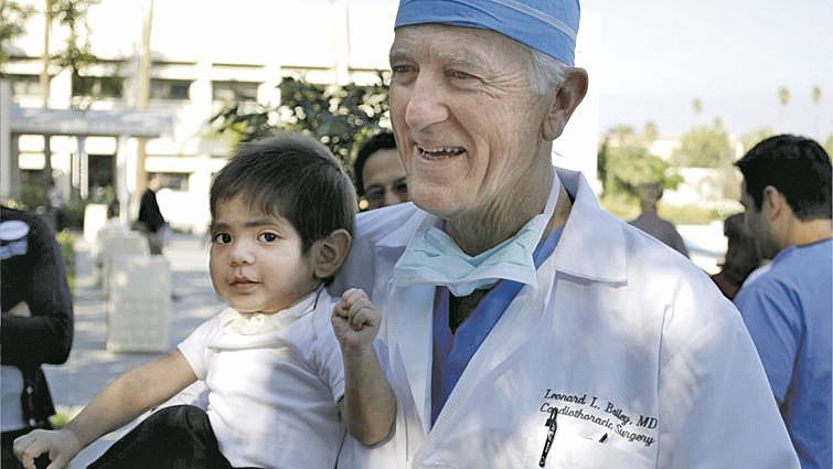 Dr. Leonard Bailey with a patient in 2009